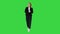Female presenter blond woman walking and pointing to the sides on a Green Screen, Chroma Key.