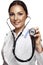 Female pretty doctor with a stethoscope listening