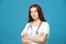 Female profession. Good family, children`s, woman pediatrician or nurse with a stethoscope isolated on a blue background. Concept