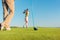 Female professional golfer hitting a long shot during a challenging game