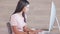 Female psychologist working on a schedule or online appointments and making notes in her calendar diary. One young