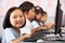 Female Pupil Using Keyboard During Computer Class