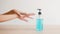 Female push alcohol bottle to clean hand for hygiene when social distancing stay at home and self quarantine time.