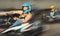 Female racer in helmet driving kart on track