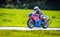 Female racer on motorbike