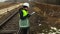 Female railway engineer inspecting warning signals