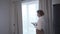 Female realtor inspects an apartment in advance of potential buyers coming in. Seller of real estate inspects property