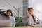 Female receptionists working at desk in hotel