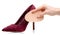 Female red suede high heels shoes insole in hand