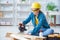 Female repairman carpenter cutting joining wooden planks doing r