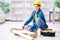 Female repairman carpenter cutting joining wooden planks doing r