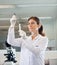 Female Researcher Analyzing Test Tube