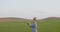 Female Researcher Examining Crop At Field