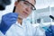 Female researcher with glass equipment in the lab