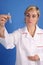 Female researcher looking at the test tube