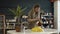 A female restorer painting a yellow detail in workshop