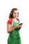 Female retail or supermarket worker listening to music on phone