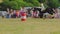 A female rider gallops on a horse, jumping over a barrier. Equestrian, Grudziadz, Poland - June 18, 2023