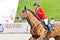 Female rider on show jump horse