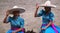 Female riders salutes in blue dresses