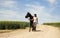 A female riding on a black horse