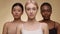 Female rights and equality. Close up portrait of three young diverse women looking seriously at camera