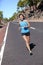 Female road runner training running outdoors