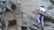 A female rock climber climbs up a rock. Learning to climb. Rock, girl, mountaineering