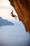 Female rock climber falling of a cliff