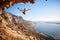 Female rock climber falling of a cliff