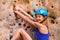 Female rock climber in helmet exercising outdoors