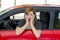 Female rookie new driver young beautiful woman scared and stressed while driving car in fear and shock