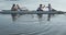 Female rowing team training on a river