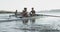 Female rowing team training on a river