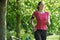 Female Runner In Park With Wearable Technology