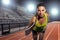 Female runner sprinter exercising and training intense track and field athlete determination for greatness in sports