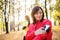 Female runners with smartphone outdoors in forest in nature, measuring time.