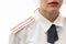 A female Russian police officer in dress uniform and a white shirt on a white background. Selective focus