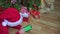 female Santa hat decorated Christmas tree swipe green mock-up screen smartphone