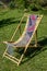 Female scarf of felted wool on bamboo lounger on lawn