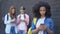 Female school pupils scrolling smartphones outdoors, gadget addiction, internet