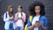 Female school pupils scrolling smartphones outdoors, gadget addiction, internet