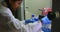 Female scientist arranging test tube in laboratory 4k