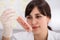 Female Scientist Holding Meat In Test Tube