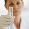 Female Scientist holding up Test Tube