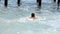 Female in the sea near the coast. Attractive woman in sea splashing water and posing to camera. Smiling girl having fun