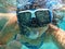 Female selfie photo under water on the beautiful Skala beach of Kefalonia island, Ionian sea, Greece