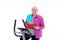Female senior with clipboard train with fitness machine