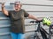 Female senior people active grandmother standing close to his e bike doing a selfie. Healthy lifestyle for retired person. Yellow