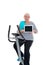 Female senior train with fitness machine and using tablet PC